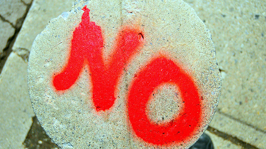 The word NO in red spray paint