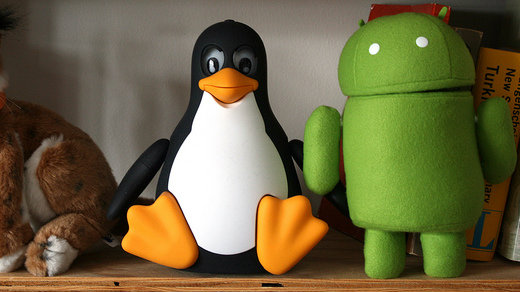 Tux and Android stuffed animals on shelf