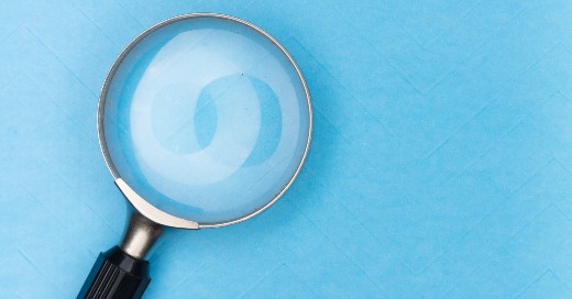 magnifying glass for search on a blue background