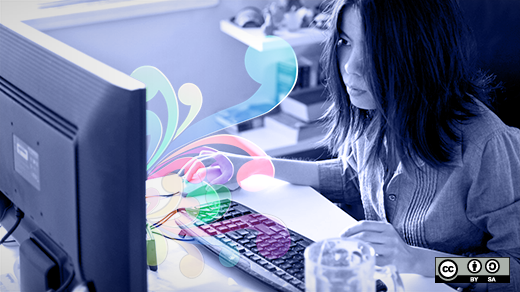 Women in computing and open source Woman sitting in front of her computer