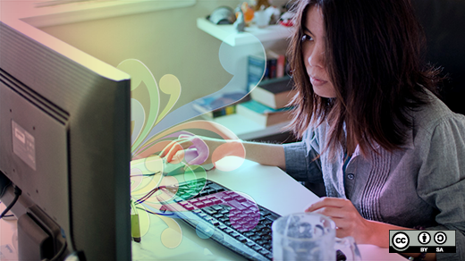 Women in computing and open source Woman sitting in front of her computer